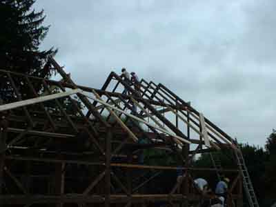 This barn frame has principal rafters and purlins with common rafters in between.
